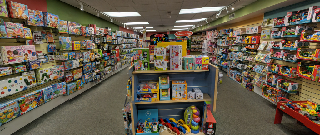 the inside of the Allison Wonderland store with rows of different types of toys, games, puzzles, art supplies and more