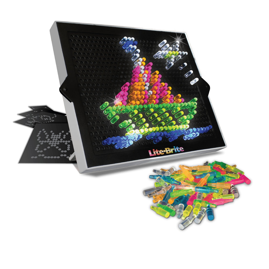 the lite brite with a sailboat pattern, pile of lite pegs, and other lite brite patterns