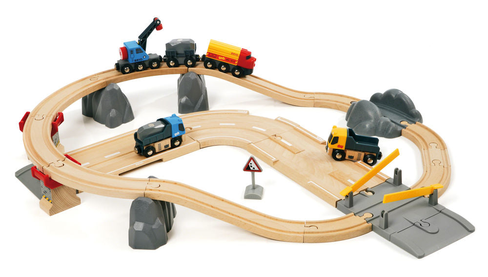 Full setup of wooden track, a crane, dumptruck, train engine, and flatbed car