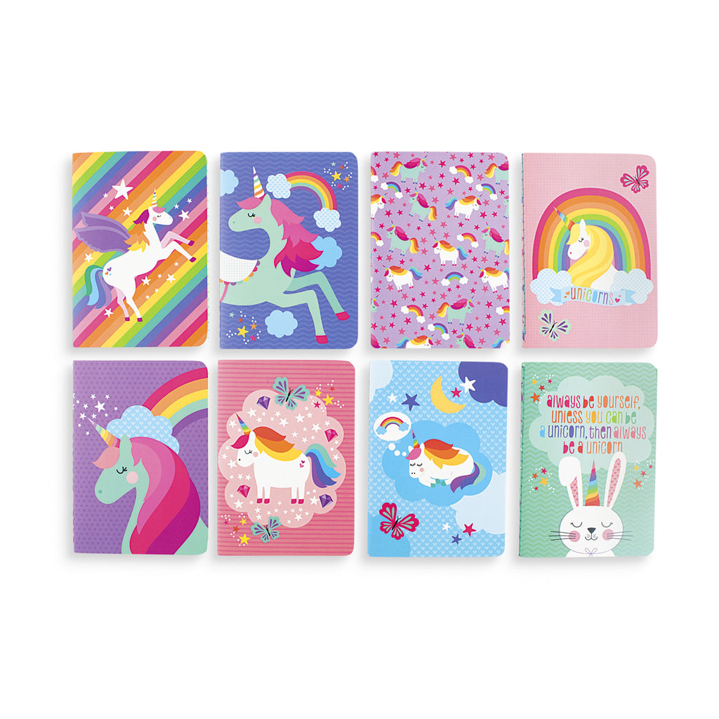 8 journals with different colorful illustrations of unicorns