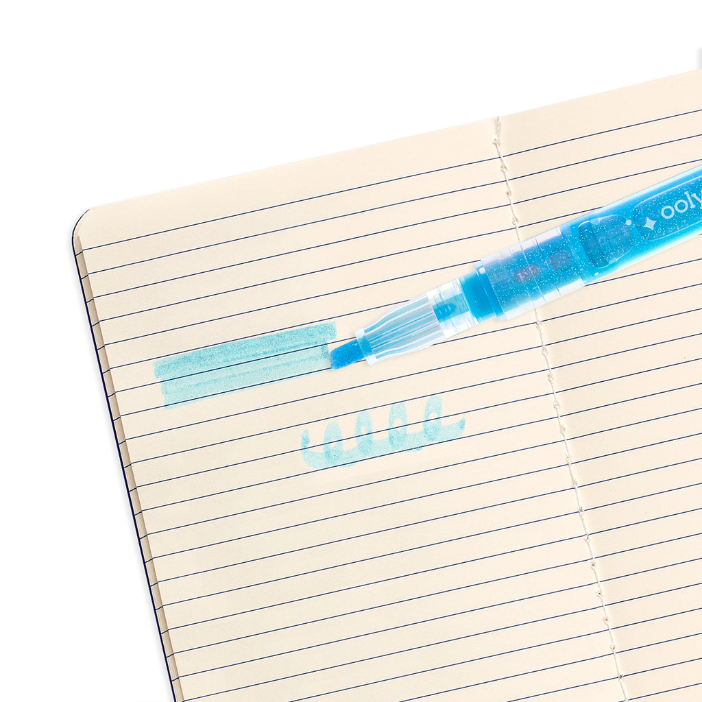 a close up of a blue highlighter in a notebook