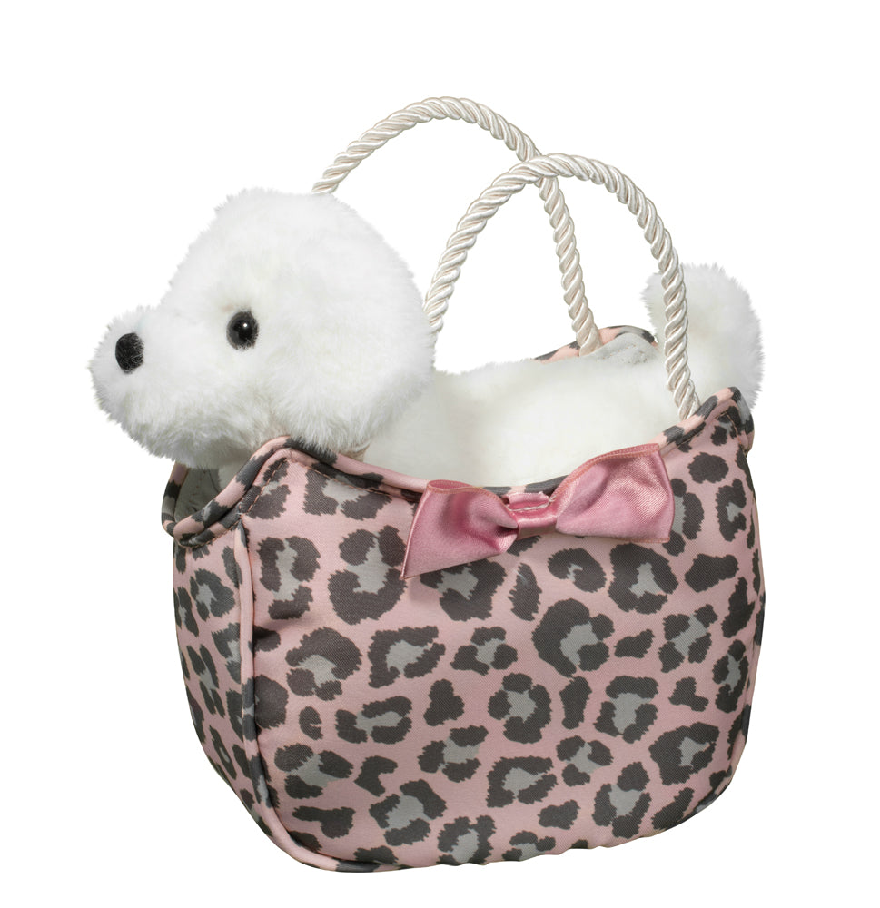 a pink leopard print bag with a white bichon stuffed toy in it