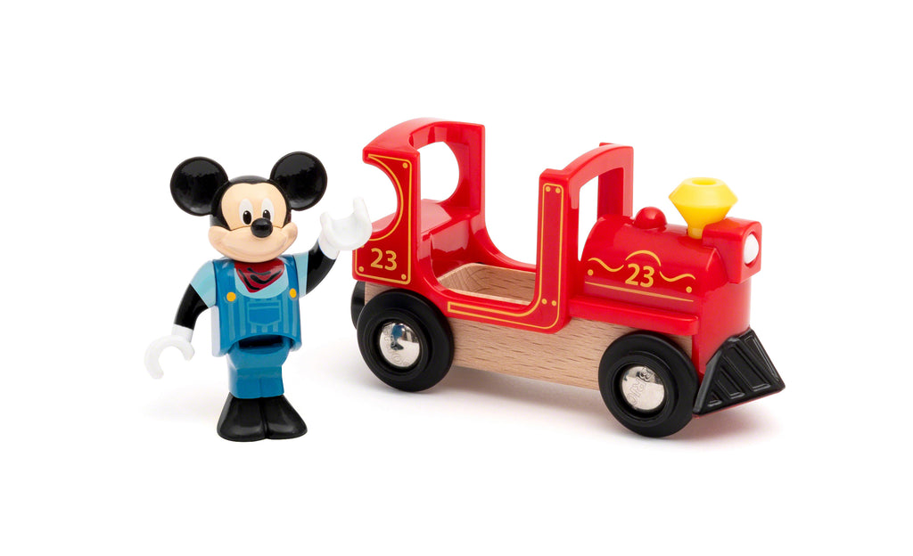 mickey mouse figure standing by the wooden and plastic red engine
