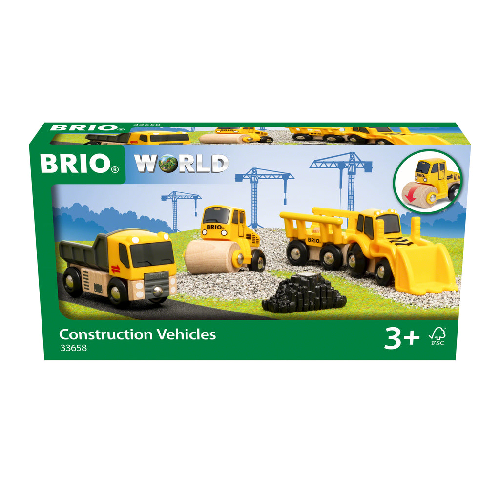 the box showing wooden earthmover, dumptruck, and roller