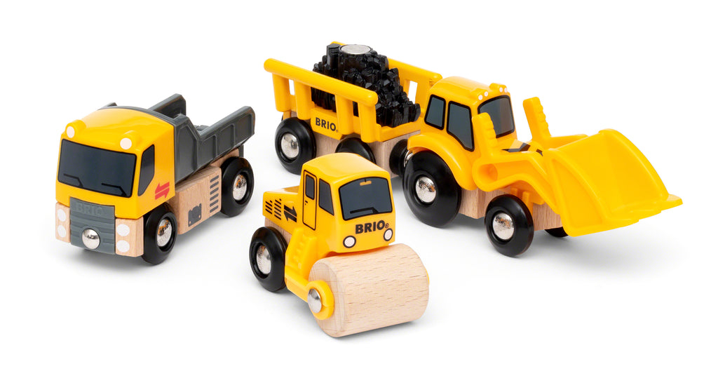close up of wooden earthmover, dumptruck, and roller
