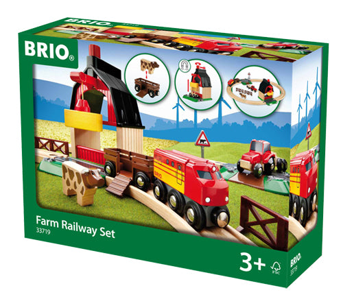 the box showing the wooden train, track, barn with crane, and cow