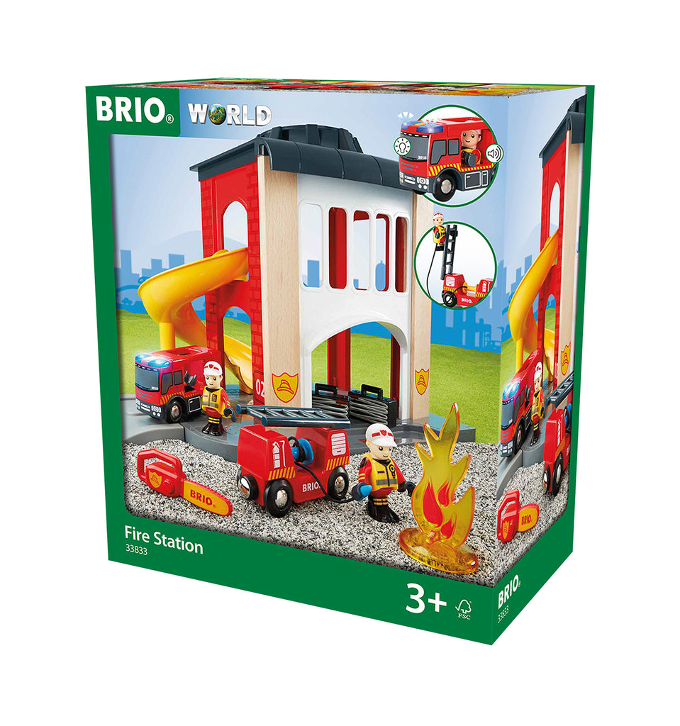 the box showing the red and white firestation with slide, lit up fire truck, a second firetruck, a chainsaw, plastic fire, and two firefighters