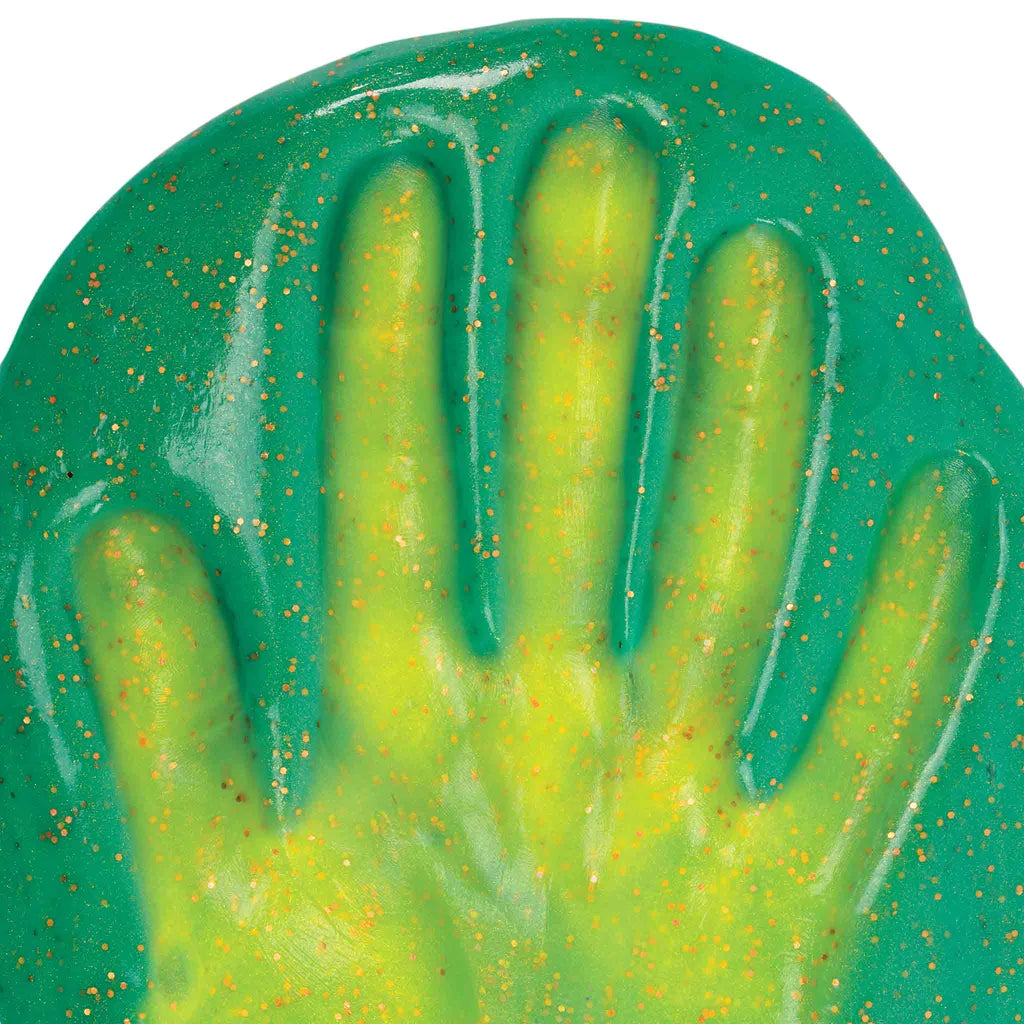 a hand covered in the glittery green putty