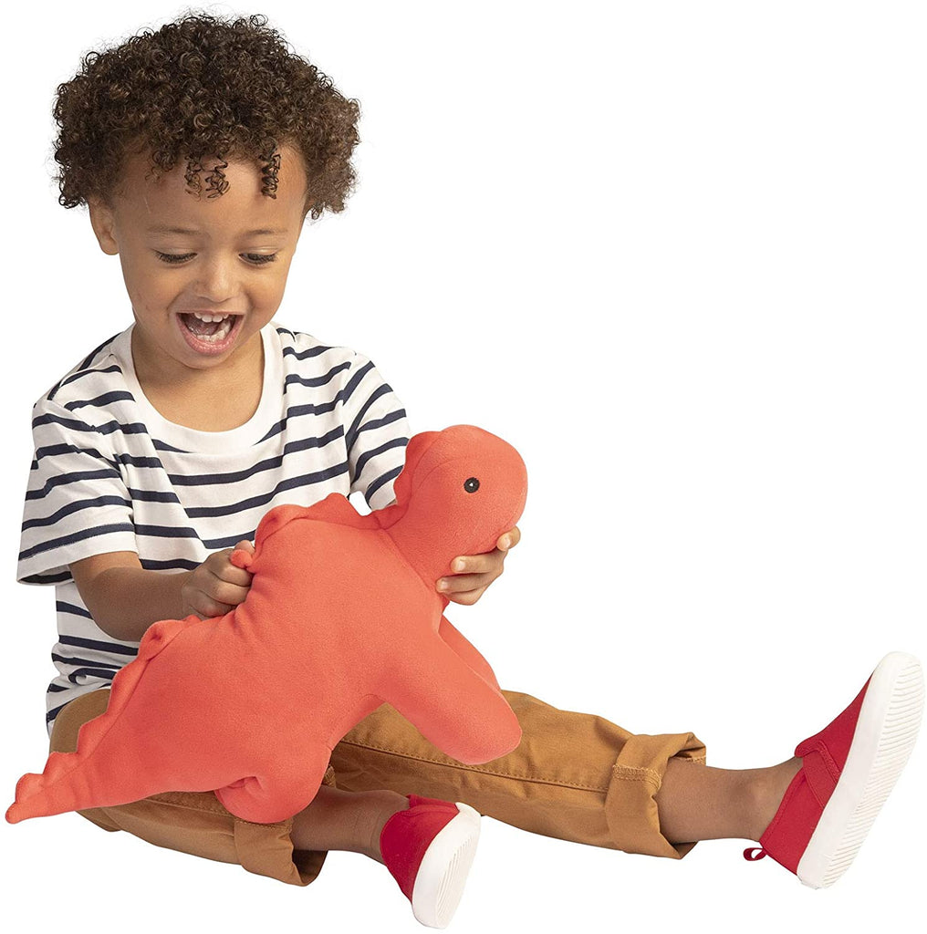 photo of child playing with pink plush stegosaurus