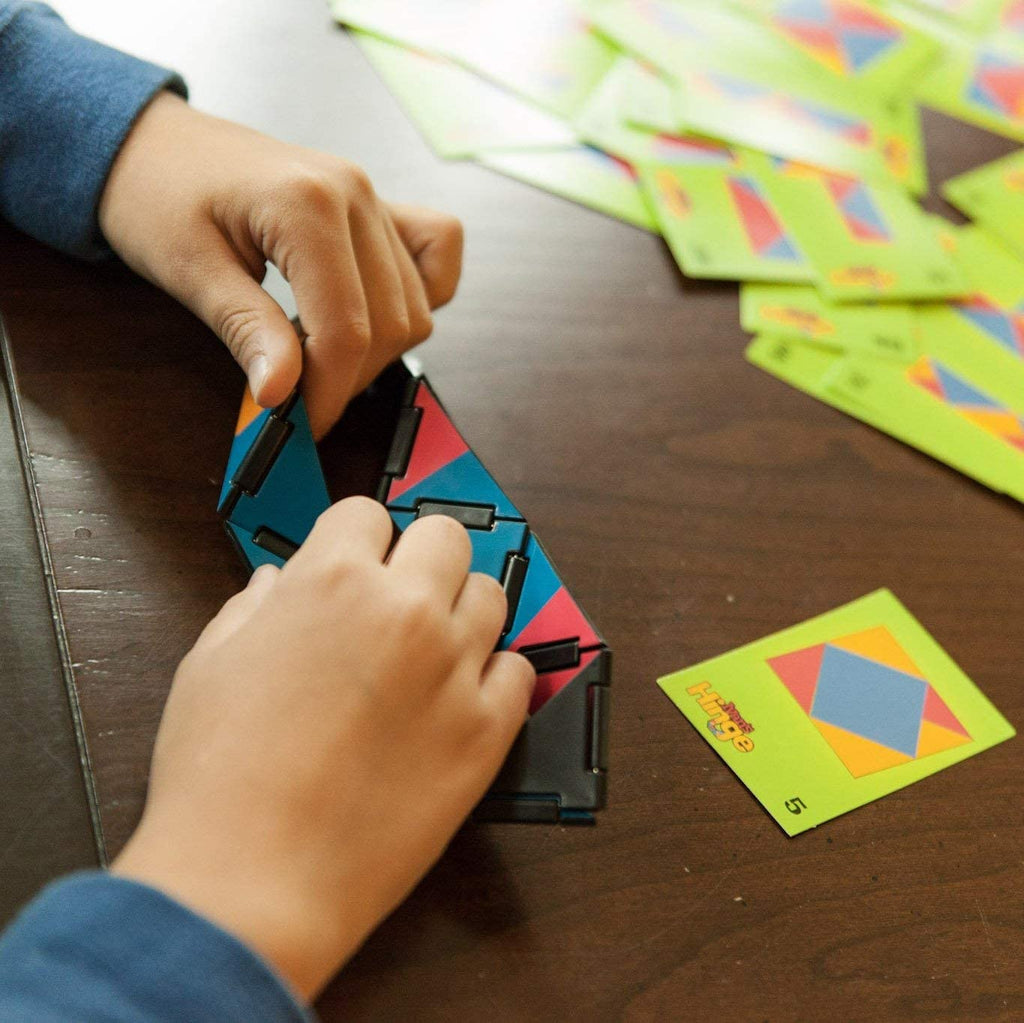 a child folding the hinges with cards nearby
