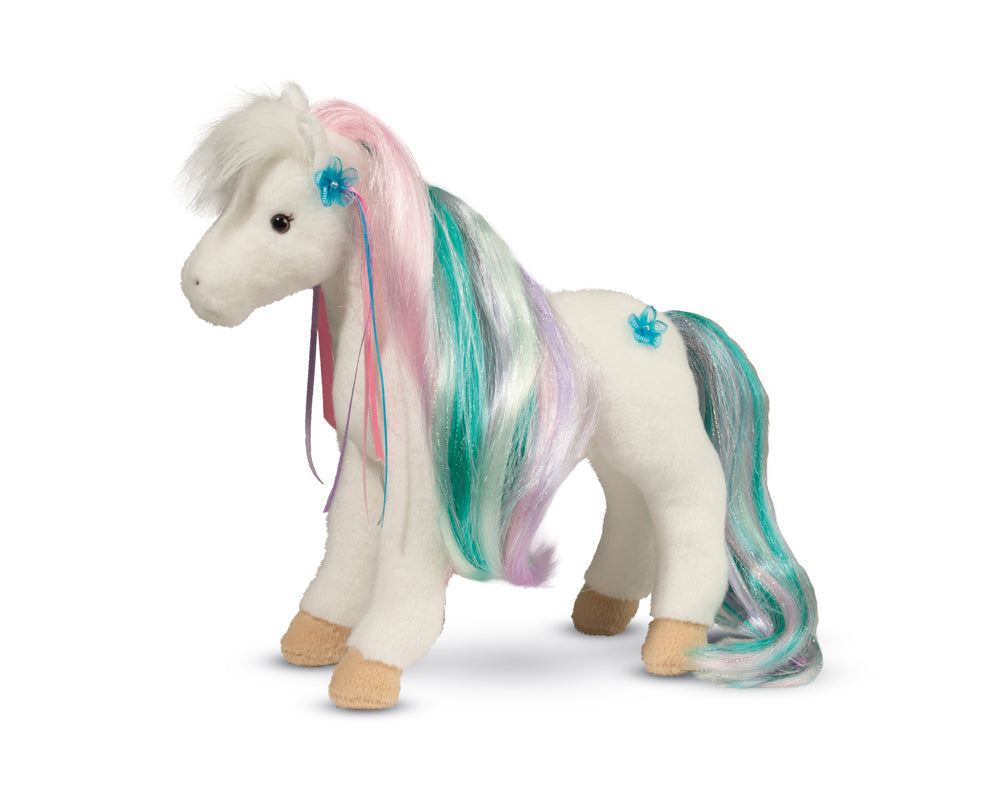 a white horse stuffed toy with pink, lavendar, white, and turquoise hair and tail 