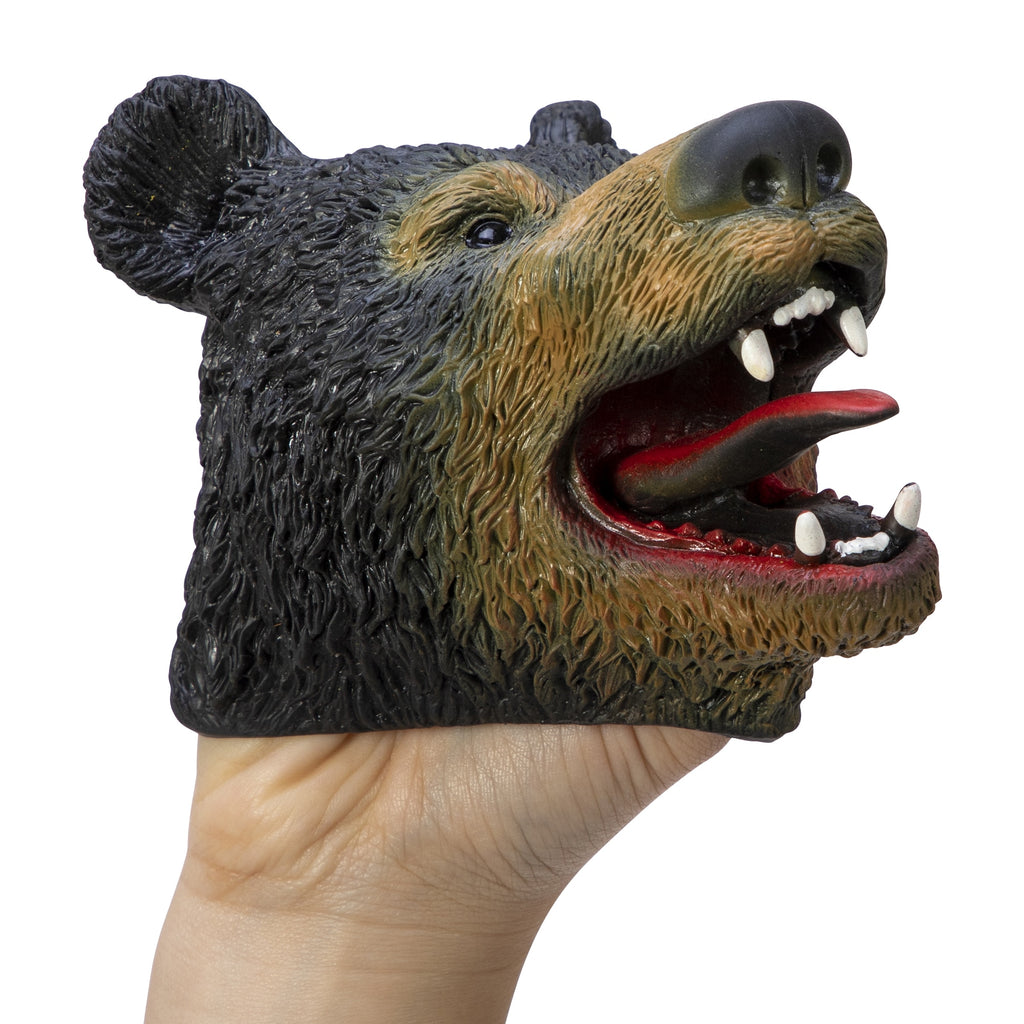 a hand with the black bear puppet on it