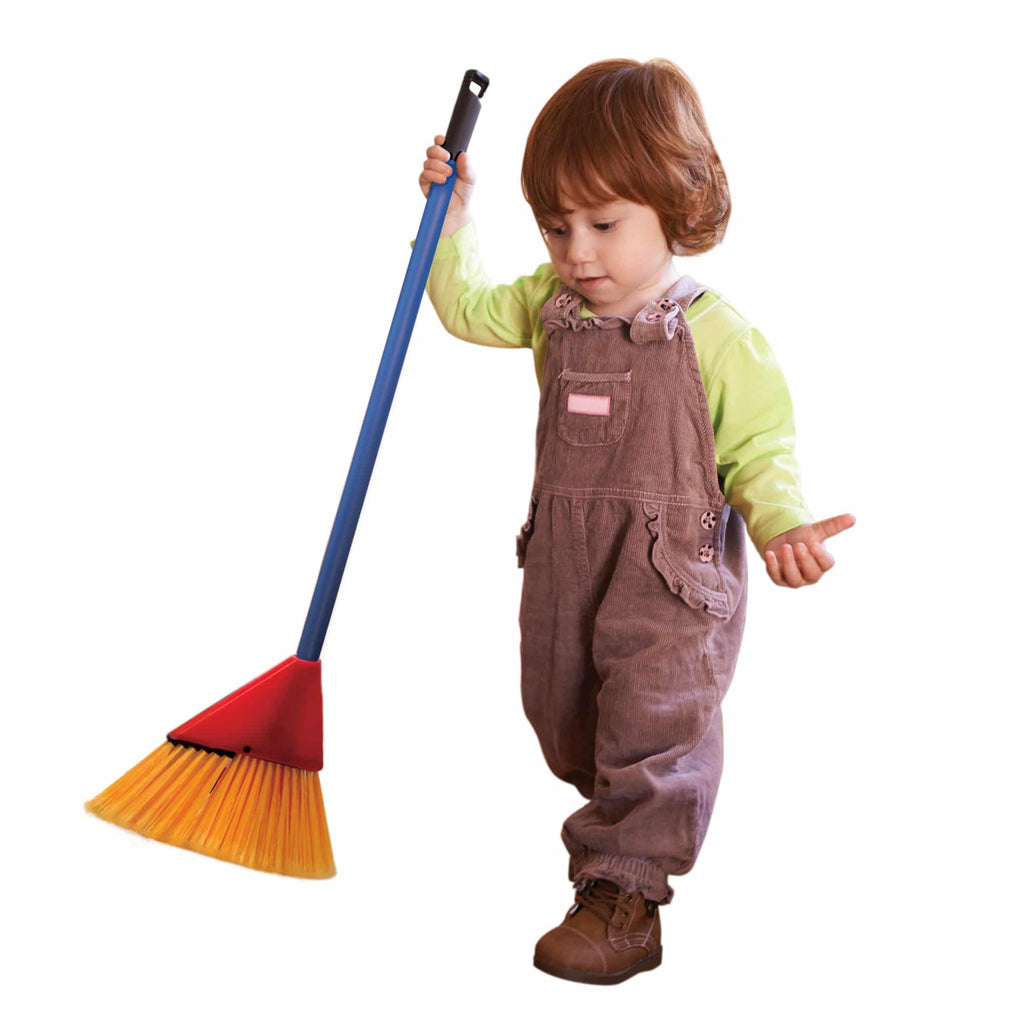 a small child with a broom