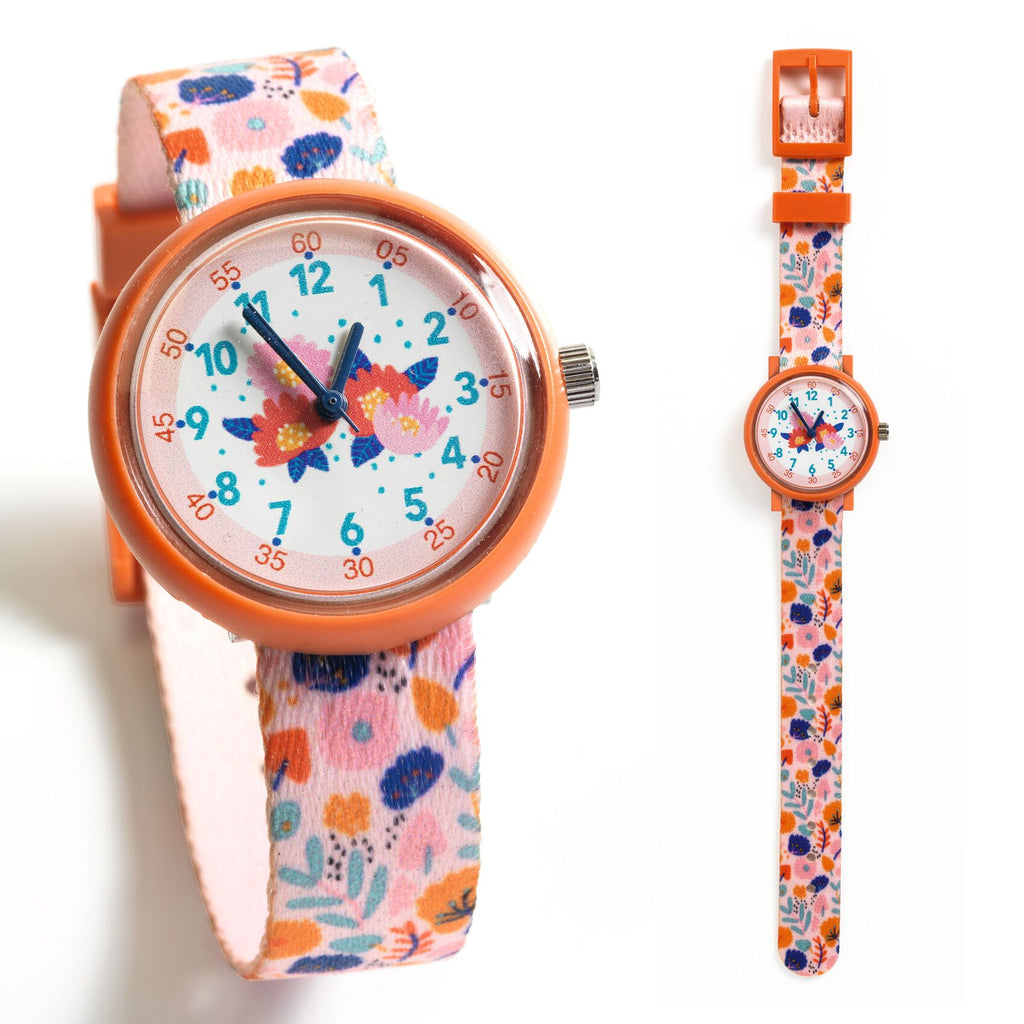 a pink watch with embroidered flowers on the watch face