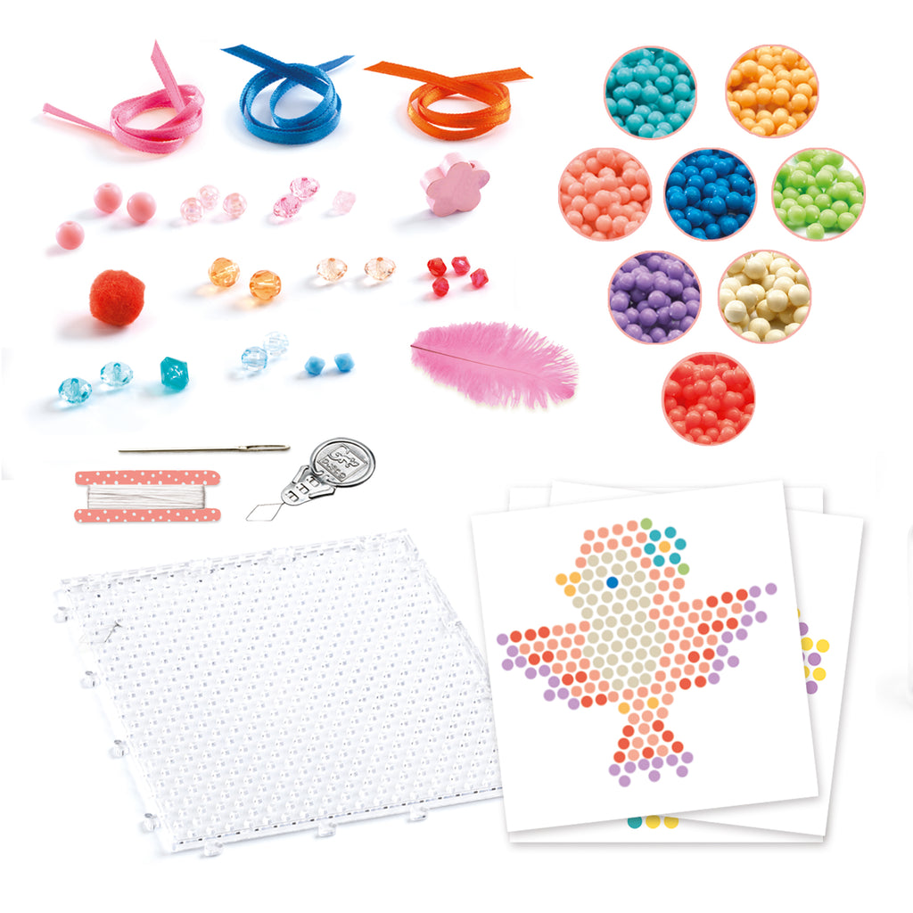 the contents showing patterns, plastic jewels, ribbon, a feather, and tools to make animal charms