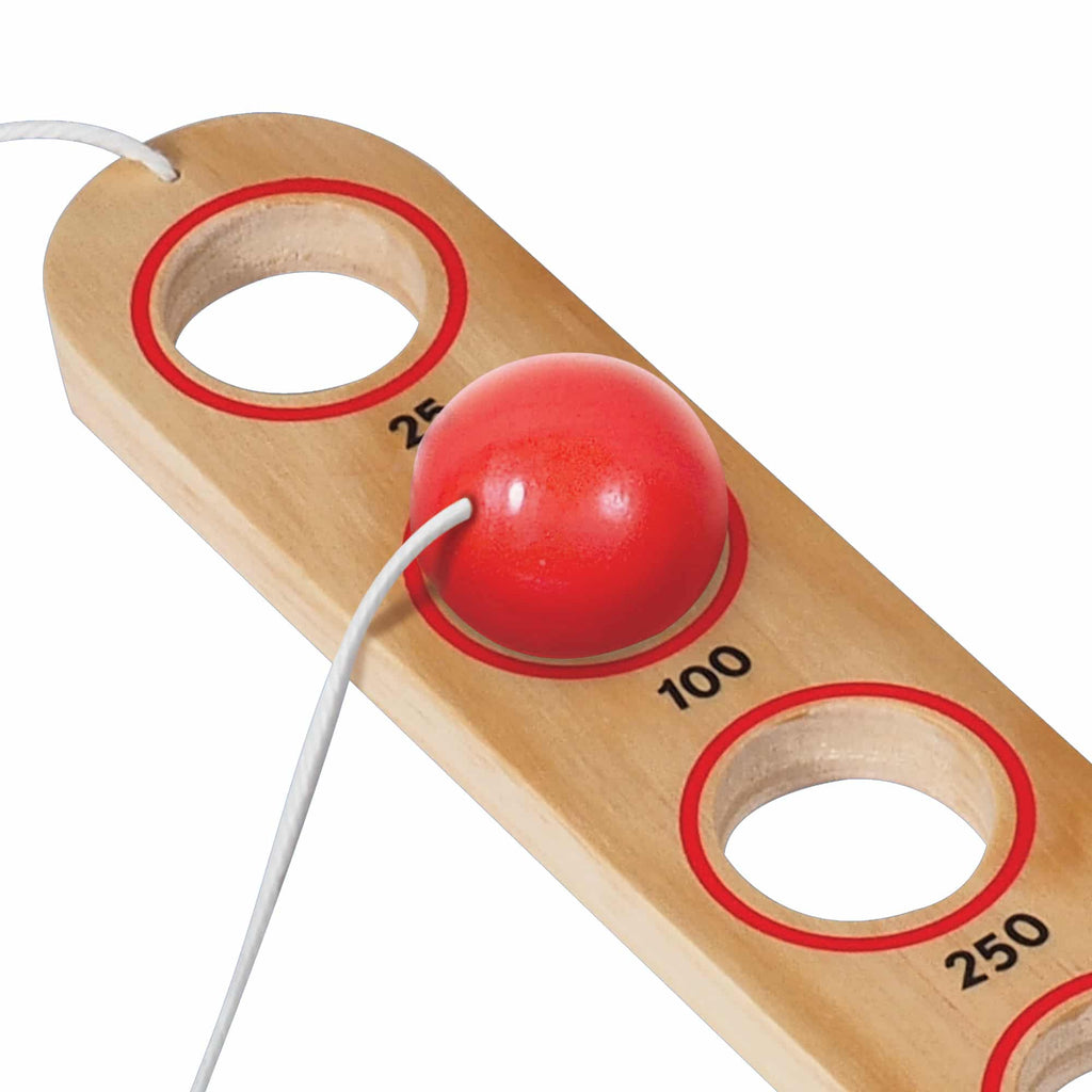 a close up of the flip stick ball in the 100 point hole