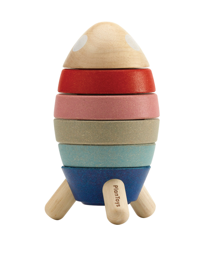 the wooden rocket is made of stacked multicolored rings