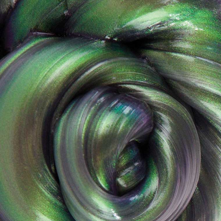 a close up of the metallic green and black putty