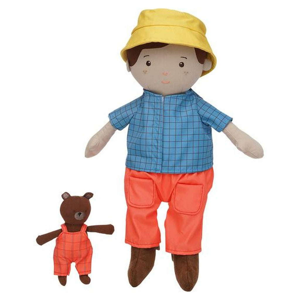 photo of a plush doll boy wearing a blue shirt, peach pants and yellow hat and teddy bear in peach overalls 
