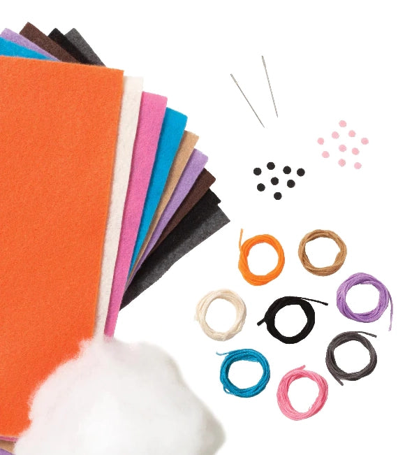 the contents of the sewing kit with felt, stuffing, needles, and thread